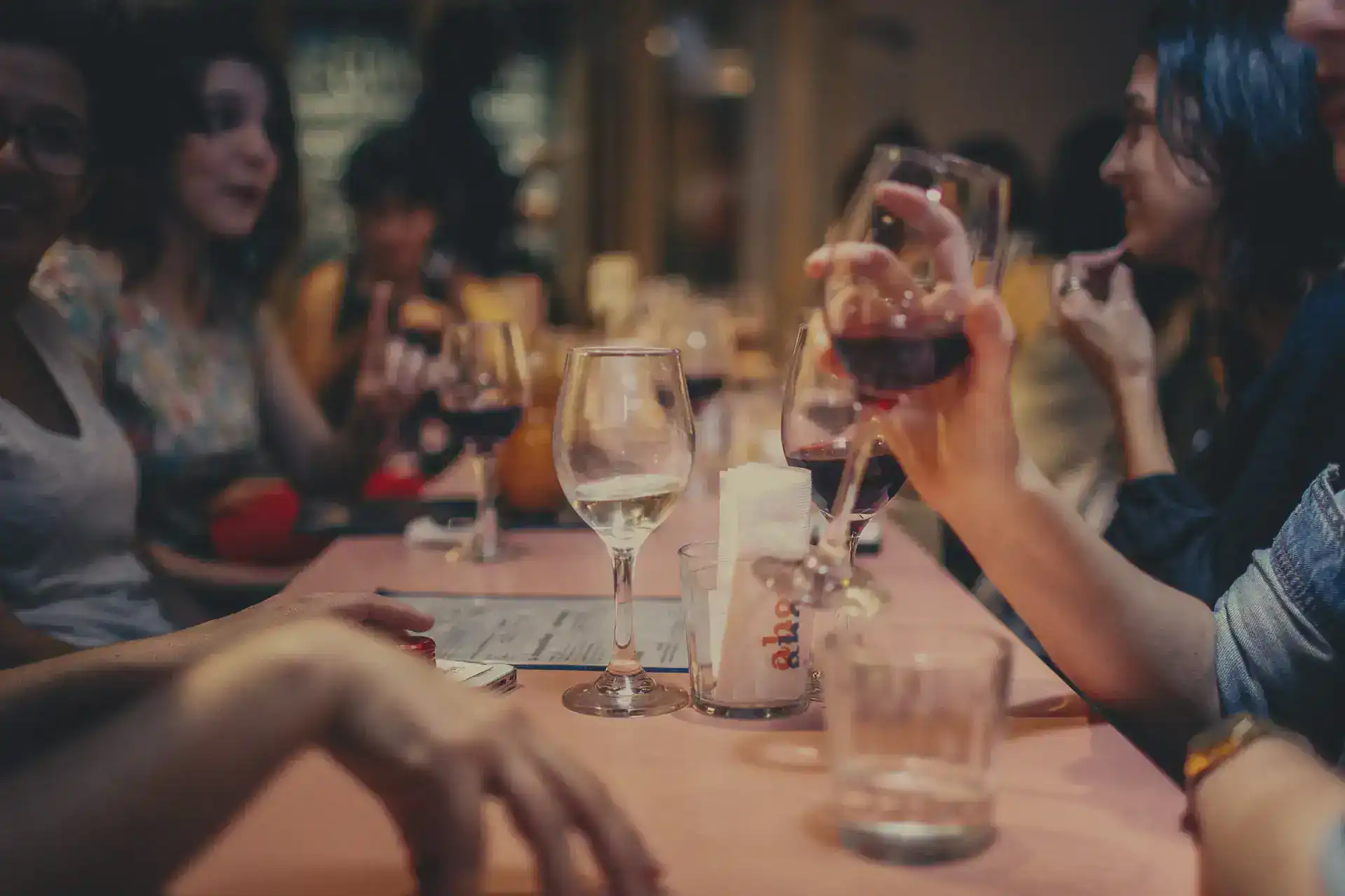 People enjoying drinks at a table
