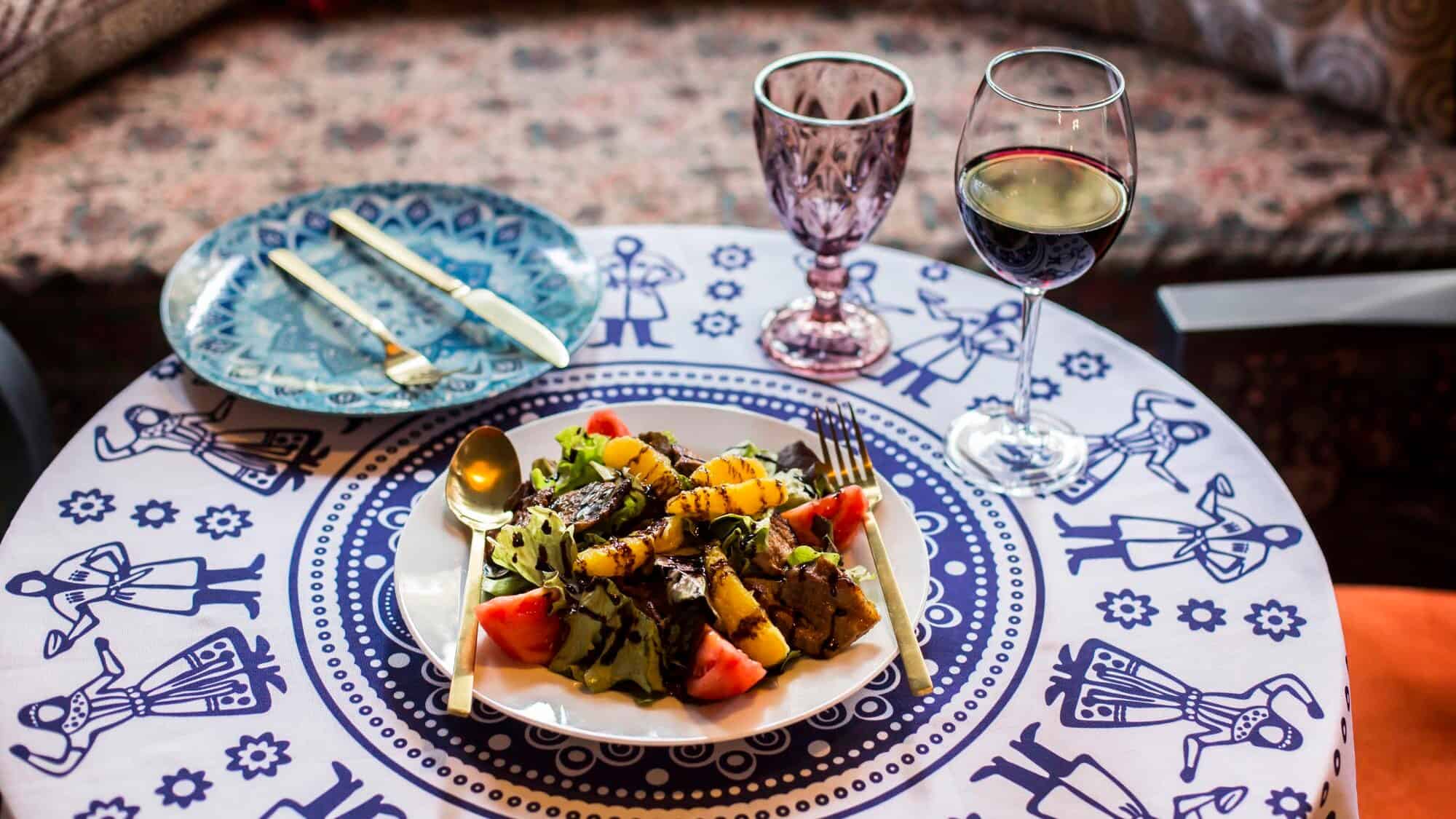 Colorful meal with wine and utensils