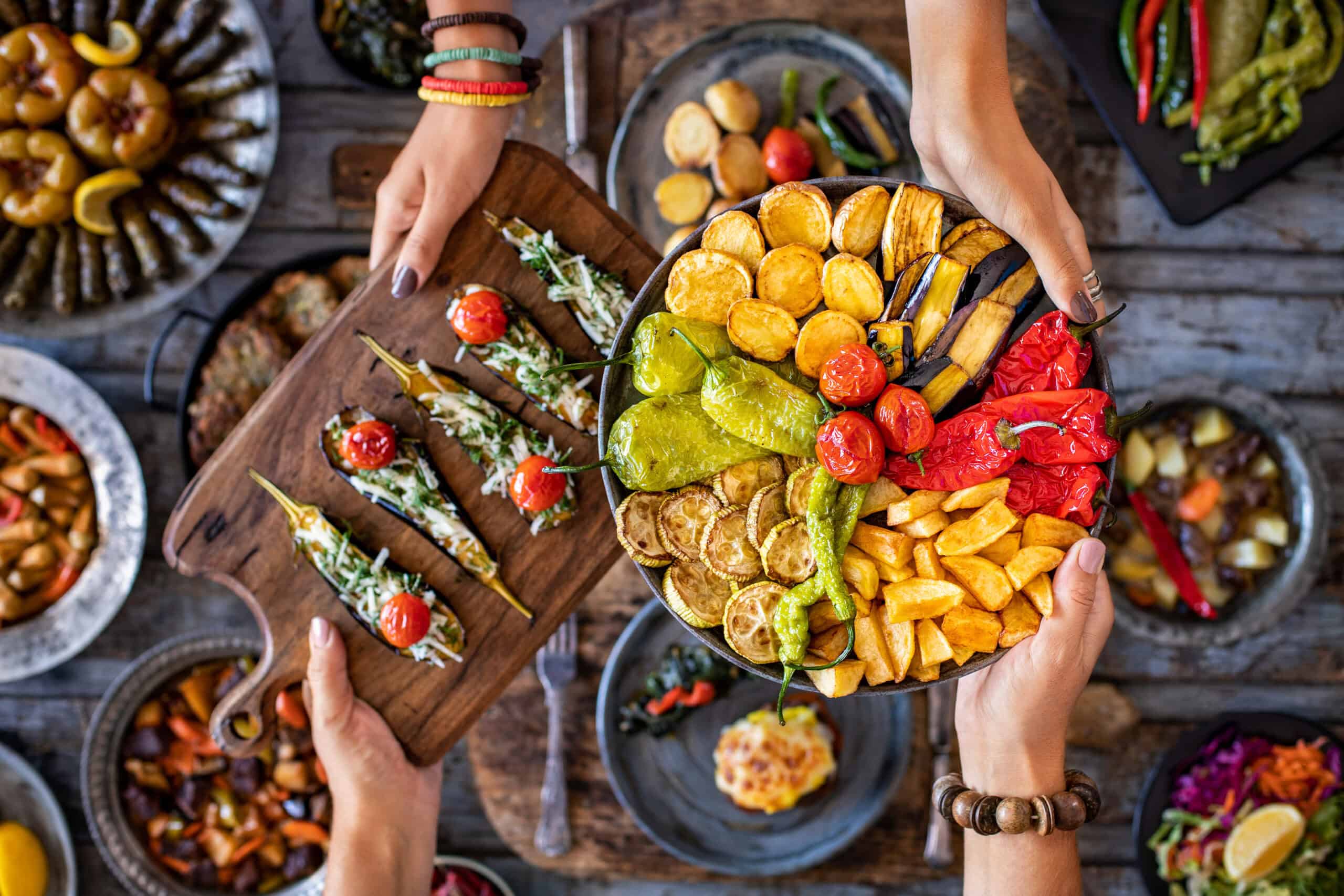 Gathering around a table with food