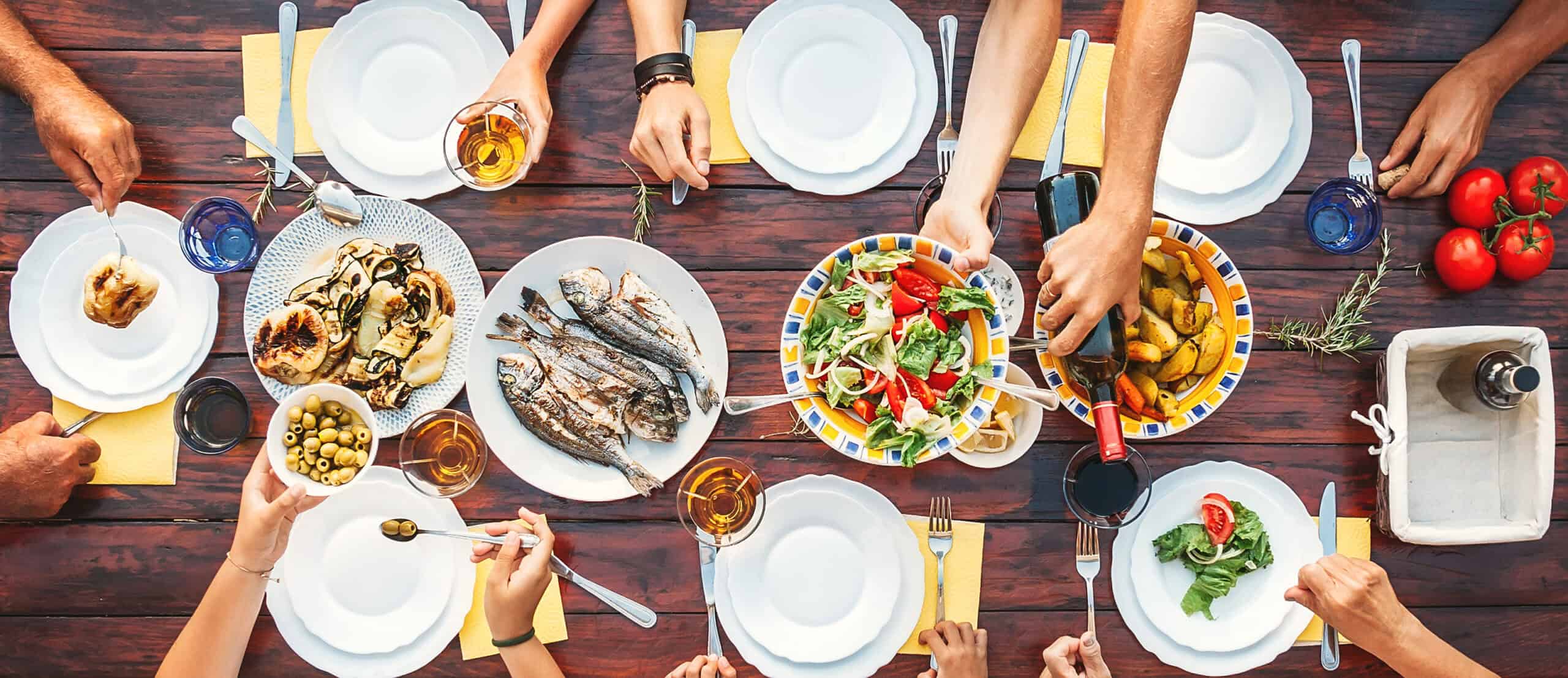 Gathering around a table with food