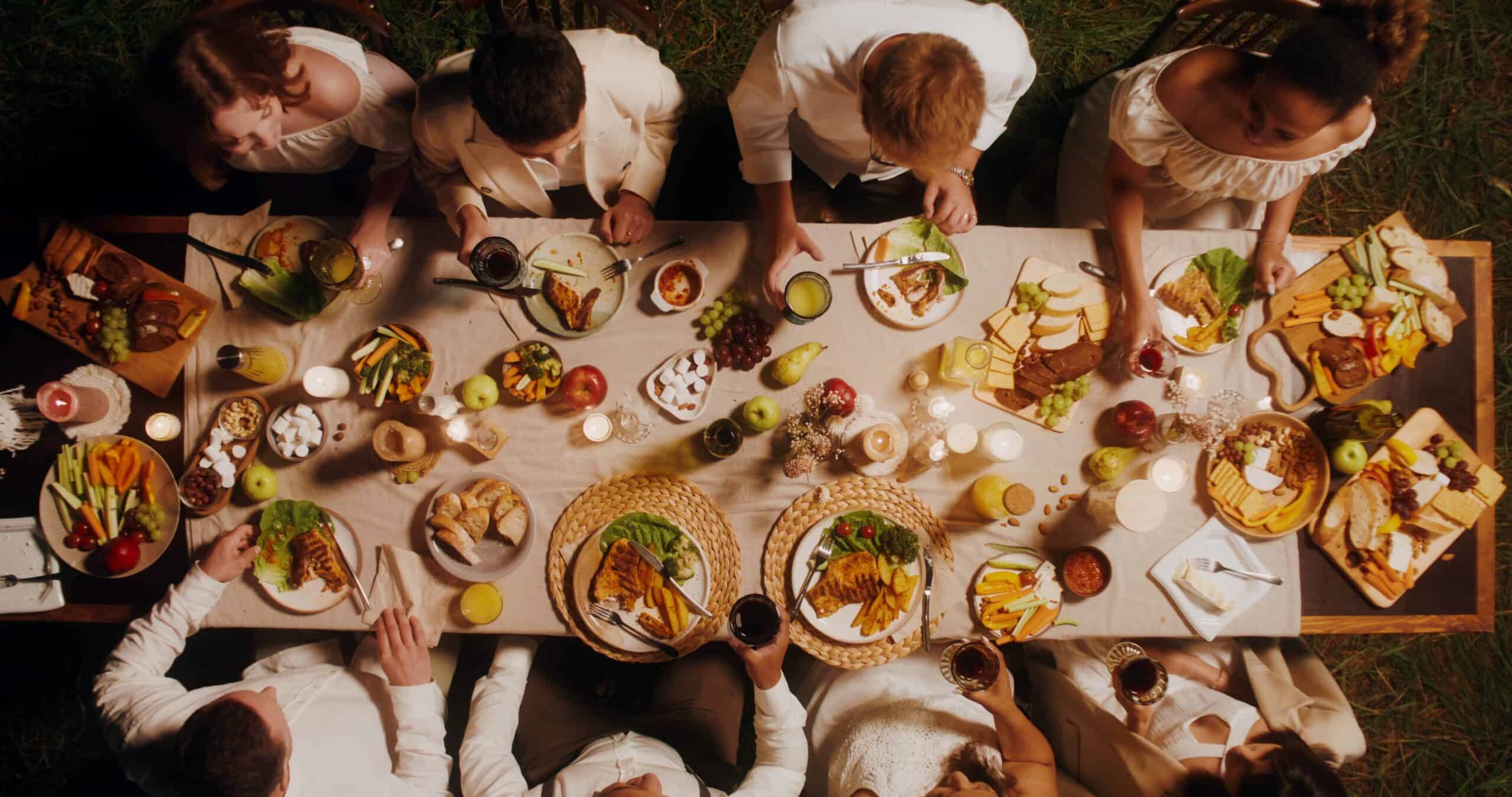 Outdoor dinner party with diverse dishes